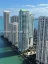 High-rise urban residential towers with waterfront positioning and balcony architectural detailing