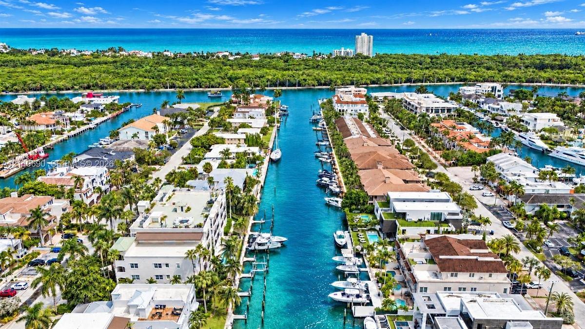 Waterfront community featuring pristine canals with private boat docking, lush tropical landscaping throughout the neighborhood, Mediterranean and con