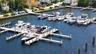 Deep-water marina featuring concrete finger piers and extensive boat slips