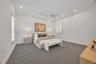 Spacious bedroom featuring recessed lighting, a ceiling fan with integrated lighting, patterned wall-to-wall carpeting, and plantation shutters
