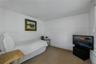 Staff Suite: Neutral-toned wall-to-wall carpeting and crisp white interior paint finish