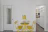 Built-in wall niche, wood-finish flooring, white cabinetry with glass-front uppers, and six-panel interior door