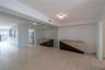 Full-wall mirror installation, ceramic tile flooring, and crown molding