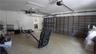 Attached multi-car garage featuring automated door openers and integrated wall-mounted storage shelving