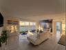 Open-concept living area featuring large-format ceramic tile flooring, floor-to-ceiling glass sliding doors, and a private balcony