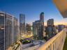 Private balcony with a metal railing and high-rise cityscape perspective