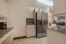 Wood-finish flooring, sliding glass balcony doors, and prominent ocean exposure
