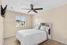 Neutral wall finish, tile flooring, and ceiling fan with integrated light fixture