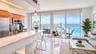 Kitchen featuring stone-surface countertops, wood-finish cabinetry, stainless steel appliances, and tile flooring, with floor-to-ceiling glass panelin