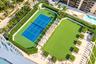 Tennis court, expansive synthetic turf lawn, white pergola structure, and landscaped privacy hedging