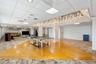 Fitness area featuring rubberized flooring, expansive wall-to-wall mirrors, and recessed ceiling lighting