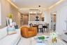 Kitchen featuring wood-finish paneling, white stone countertops, built-in stainless steel appliances, open shelving, and a statement branch-style chan