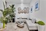 Polished concrete flooring paired with a tiered crystal chandelier and recessed ceiling lighting