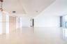 Open-concept interior featuring light-toned tile flooring, floor-to-ceiling windows, natural finish wood doors, and a contemporary linear pendant ligh
