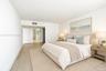 Spacious interior featuring light-toned wood-finish flooring and neutral wall finishes