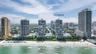 High-rise oceanfront towers featuring direct beach access, coastal proximity, and extensive landscaped grounds