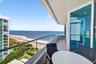 Private balcony featuring glass panel railing, tile flooring, and floor-to-ceiling glass sliding doors. Additional protection for your furniture with 