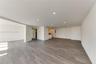 Open-concept interior featuring wood-finish flooring, recessed lighting, and neutral wall tones