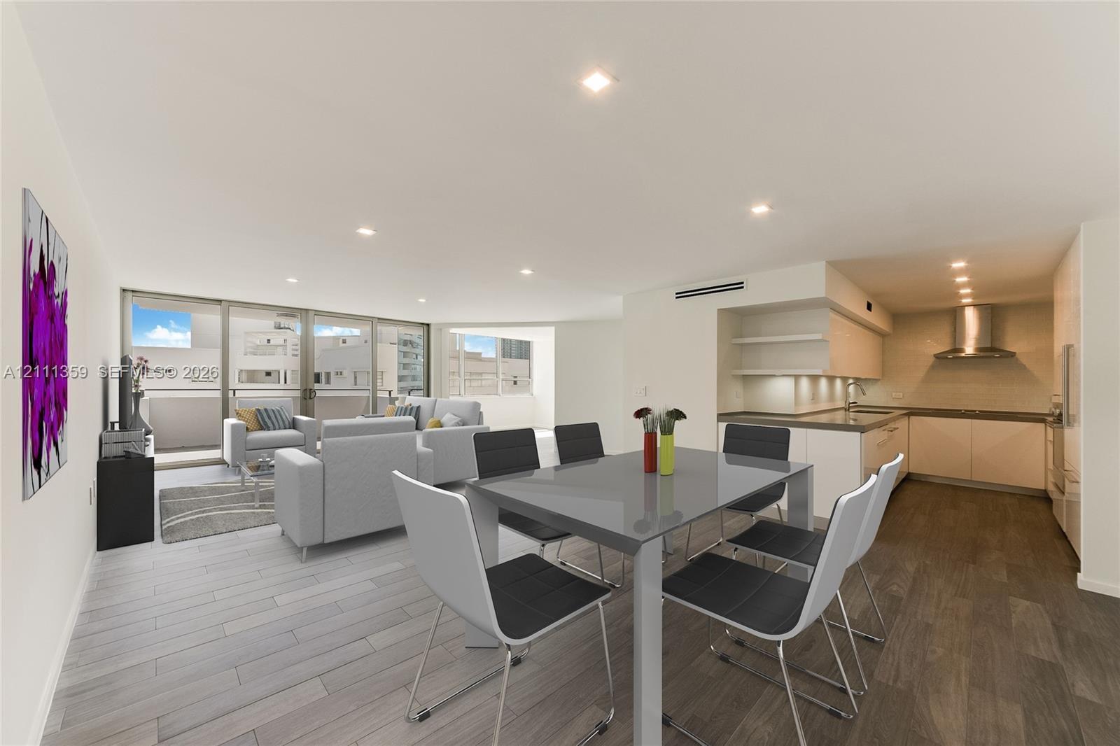 Open-concept living space featuring wood-finish flooring, recessed lighting, floor-to-ceiling glass sliding doors, and a kitchen equipped with flat-pa