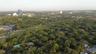 Aerial perspective of a sprawling parcel featuring dense mature tree cover and expansive greenery
