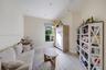 Interior room featuring neutral wall tones, wood-finish flooring, recessed ceiling lighting, and a single-pane window