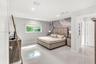Spacious room featuring polished tile flooring, recessed lighting, and a large-format textured accent wall