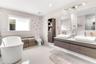 Floating vanity featuring wood-finish cabinetry, dual vessel sinks, and stone-surface countertop, complemented by a freestanding soaking tub, vertical