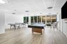 Recreation room and saunas by pool Baths & lockers