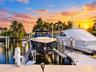 Private deep-water dock featuring multiple motorized boat lifts and integrated piling systems