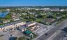 Commercial property featuring street-front exposure, paved surface parking, and a prominent corner lot location