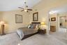 Vaulted ceilings featuring a central ceiling fan with integrated lighting