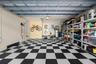 Garage interior featuring a black-and-white checkered flooring