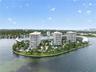 Waterfront high-rise community featuring landscaped grounds, palm tree-lined pathways, and expansive shoreline access