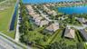 Aerial perspective of residential community featuring homes with hip-style rooflines, screened-in pool enclosures, paved street infrastructure, and pr