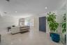 Interior space featuring polished terrazzo flooring, recessed lighting, and a large wall-mounted mirror panel