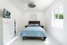 Interior space featuring polished white tile flooring, recessed lighting, and a contemporary circular flush-mount ceiling fan