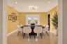 Dining area featuring polished stone-finish flooring, recessed lighting, a modern multi-arm chandelier, and glass-paneled double doors