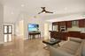 Open-concept living space featuring vaulted ceilings, polished stone tile flooring, recessed lighting, and a modern ceiling fan