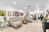 Neutral-toned polished tile flooring, recessed lighting, crown molding, and a front entry door featuring frosted glass paneling