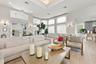 The beautifully appointed clubhouse offers an inviting gathering space with comfortable seating, soaring ceilings, and an elegant atmosphere for resid