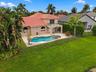 An incredible outdoor retreat! The expansive pool deck, covered patio, and private pool and spa offer endless opportunities for entertaining or simply