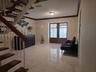 Open foyer featuring wood-tread staircase, white metal railings, ceramic tile flooring, and double-entry doors with glass paneling