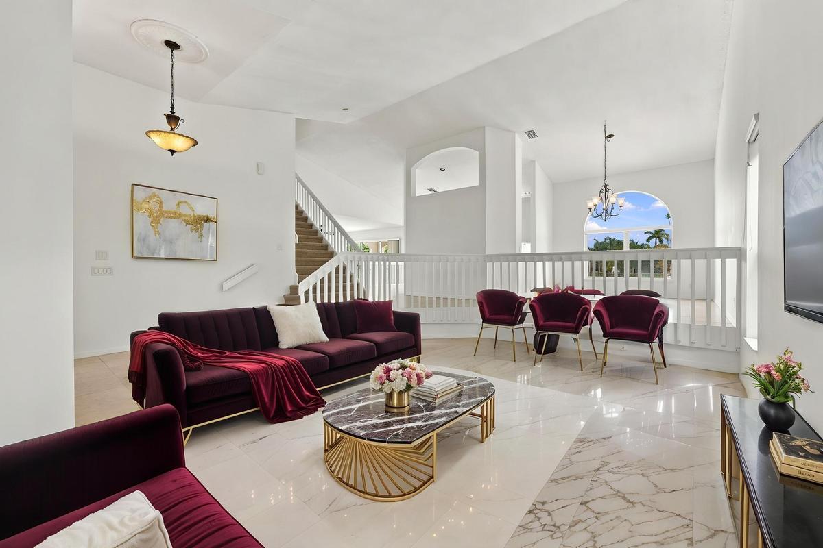A beautiful combination of soaring ceilings, expansive living space, and architectural details offers endless possibilities for entertaining and every