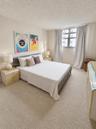 Neutral interior featuring wall-to-wall carpeting and a multi-pane window