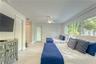 Bedroom #2 with exterior door to escape to the pool...
