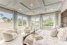 Primary Bedroom with walk in closet, en suite bathroom & sitting area with Sofa Sleeper