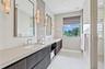 En Suite Primary Bathroom #1 with Double Sink & Shower.