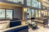 Outdoor waterfront Point Lot with pool area with outdoor dining, lounge chairs, BBQ & siting area.
