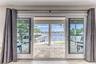 BEDROOM #1 (Upstairs) KING Size with Balcony overlooking waterway, En Suite bathroom w jacuzzi tub & seperate shower, Walk in closet, Smart TV