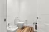 Bathroom featuring wood-finish flooring, a wall-mounted bidet with a chrome faucet, and a dual-flush toilet